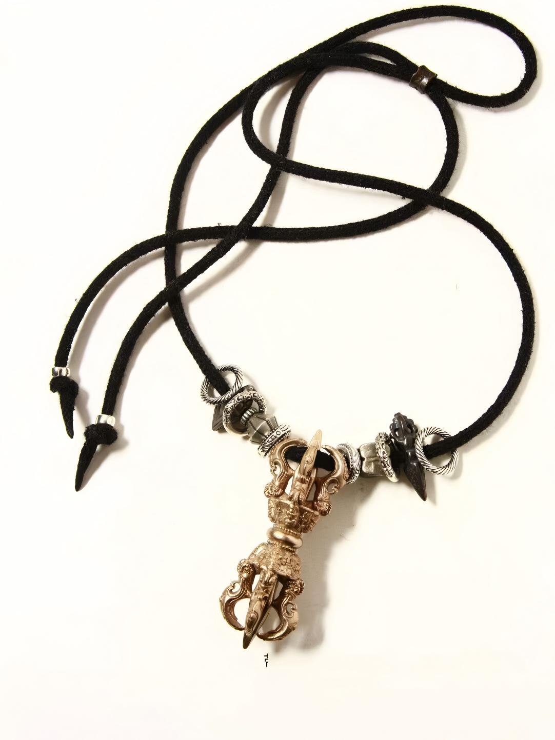 This handmade small edition Vajra jewelry features dual respect design, oxidized effects, and defects, blending Tibetan Buddhist symbols with fine craftsmanship. It represents the depth of Tibetan Buddhist art and culture.