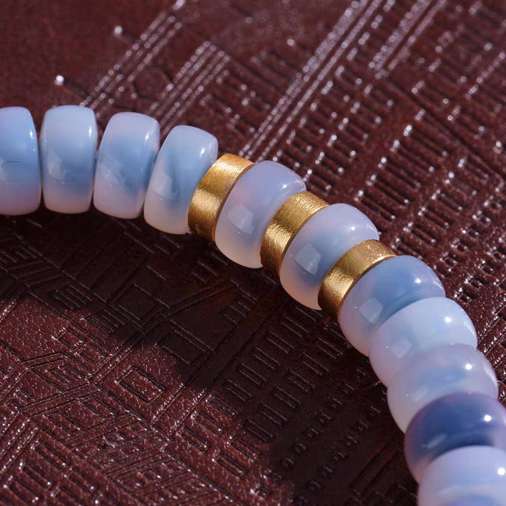 Pure handmade red meat agate Medicine Buddha bead bracelet with traditional hand-painted blue bubbles, an exquisite artifact of Tibetan Buddhist Jewelry Culture.