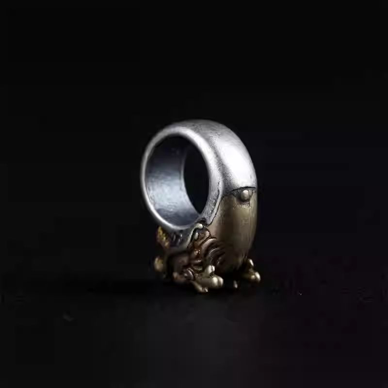 Handcrafted jewelry art sacred dragon head round ring bead, representing authority and harmonious balance in Tibetan traditions.
