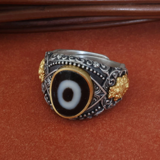 Handcrafted silver Zhakiram one-eye ring from Tibetan Buddhist Jewelry Culture, meticulously designed with traditional symbols, perfect for spiritual jewelry art lovers.