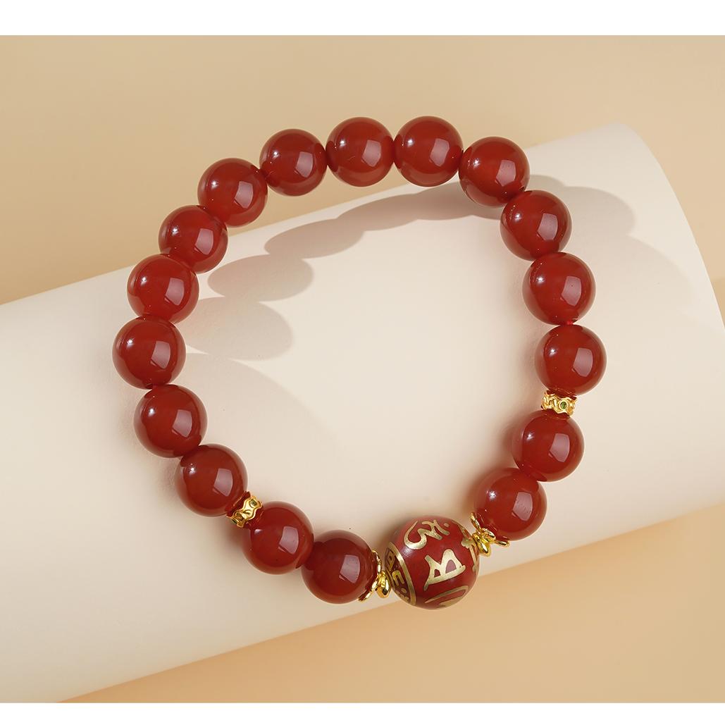 Authentic "Fortune Spring" series Tibetan Buddhist jewelry, featuring a handmade red agate spiritual bracelet that transmits positive energy and good fortune. Meticulous hand-painted details highlight its unique jewelry art and cultural heritage.