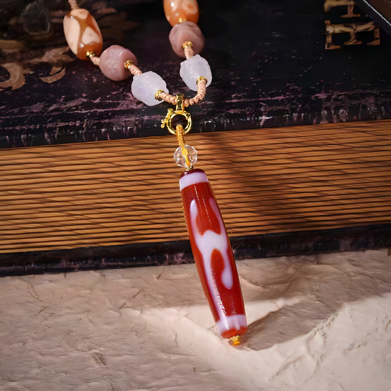 Purely handmade red meat agate Green Tara Dzi pendant, reflecting the heritage of Tibetan Buddhist Jewelry Culture jewelry art.
