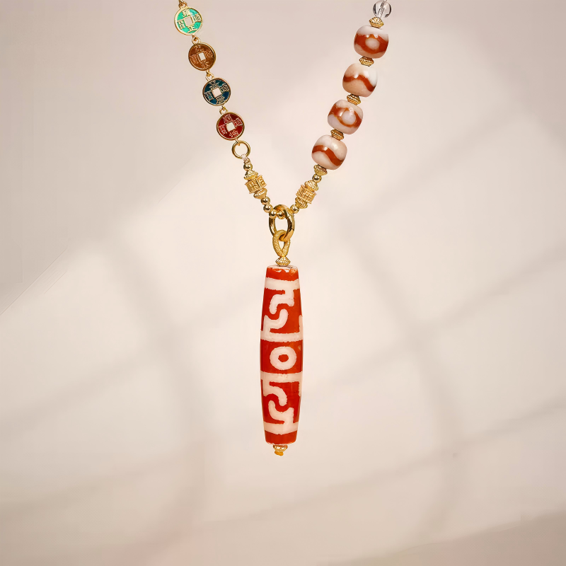 Purely handmade natural red agate sacred Guru Dzi pendant, reflecting the heritage of Tibetan Buddhist Jewelry Culture jewelry art.
