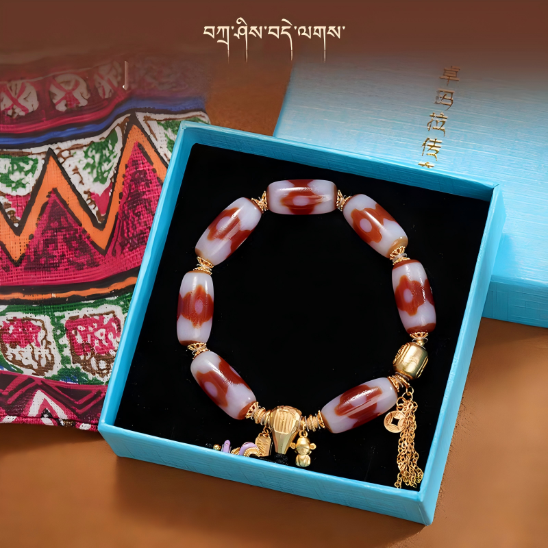 Handcrafted lucky red mutton Dzi beads bracelet, Tibetan Buddhist jewelry art piece in traditional style, promoting wealth, protection, and positive energy.