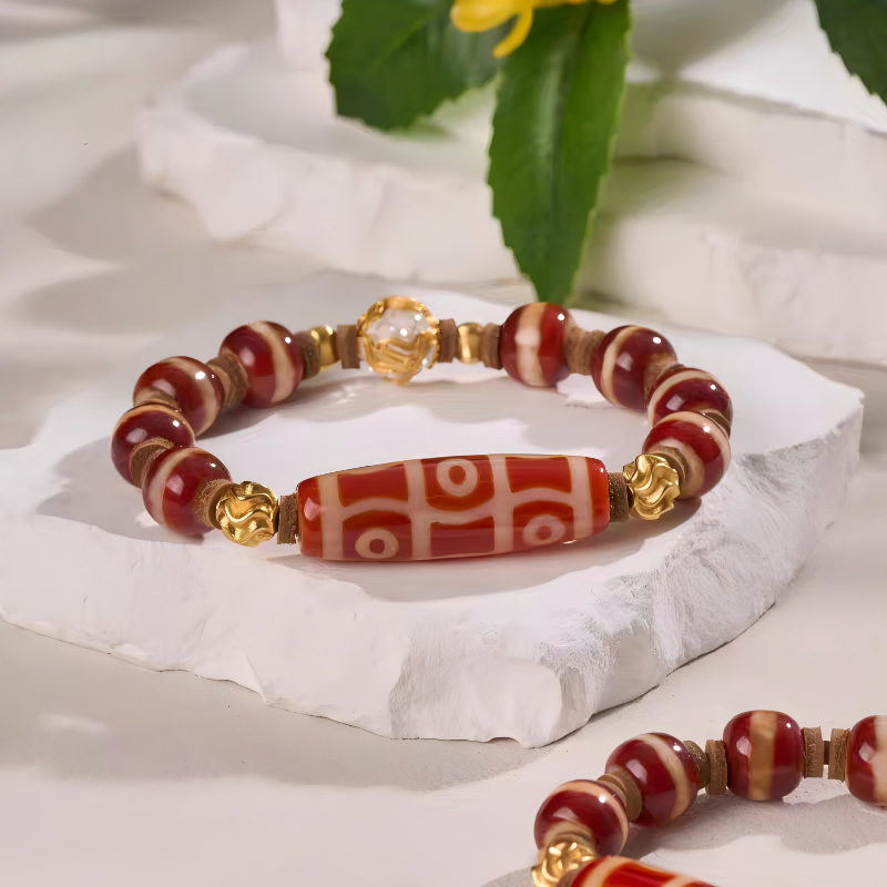 Red mutton six-eye Dzi multi-gem handmade bracelet from Tibetan Buddhist jewelry culture, combining beauty, spiritual meaning, and luck for men and women.