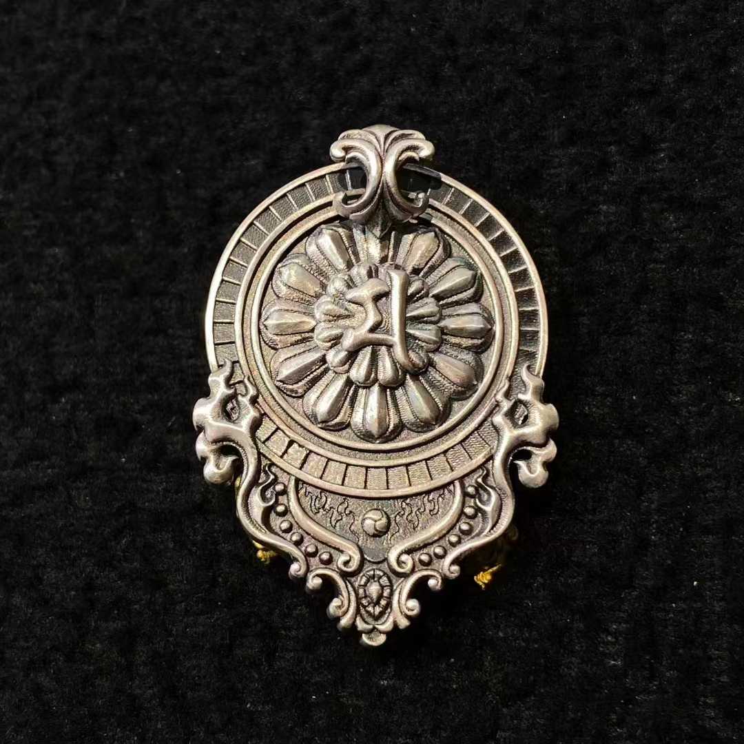 "Close-up of S925 silver Daikokuten pendant with intricate engraving, reflecting Tibetan Buddhist Jewelry Culture and fine Jewelry Art design."