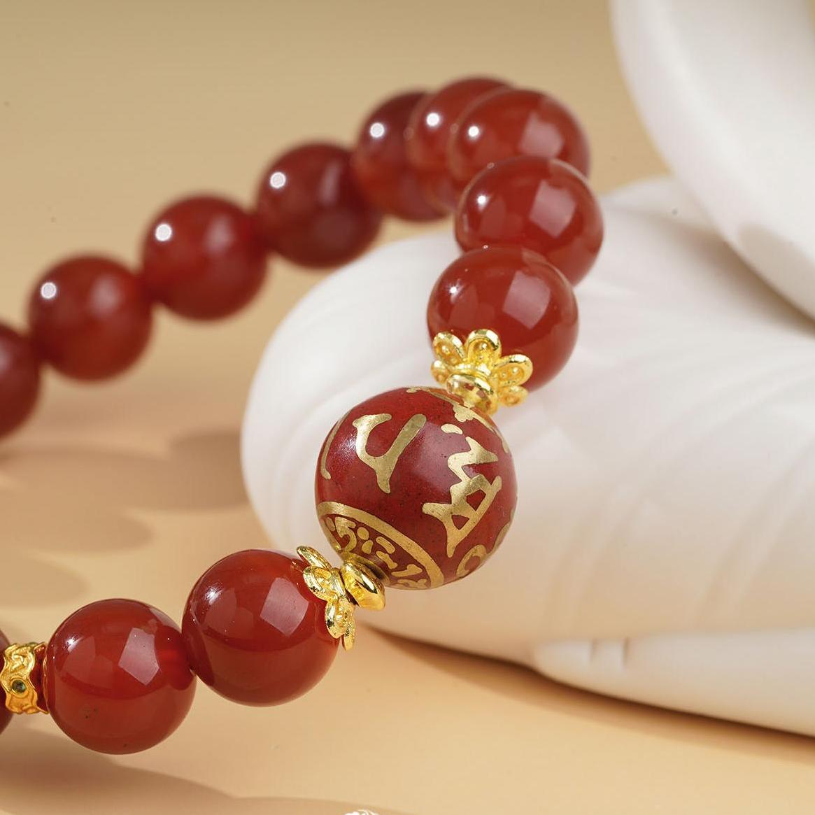 Handcrafted red agate mala bracelet, infused with Tibetan Buddhist jewelry culture. Designed for meditation and energy empowerment, aiding the wearer in attaining inner peace and strength.