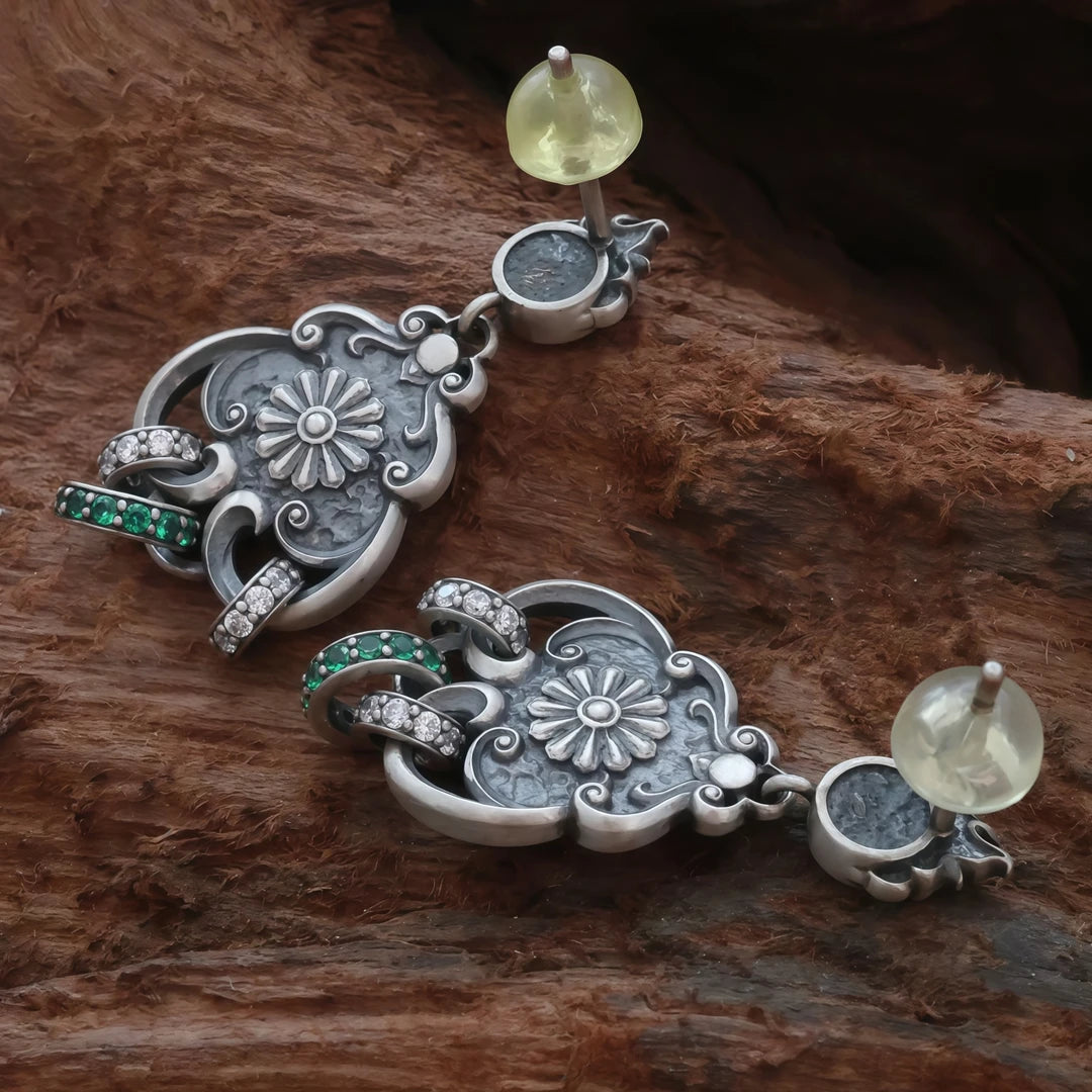 Unique handmade silver Manjushri Buddha Eye seed word stud earrings, showcasing Tibetan Buddhist jewelry culture and artisan craftsmanship, promoting wisdom and clarity.