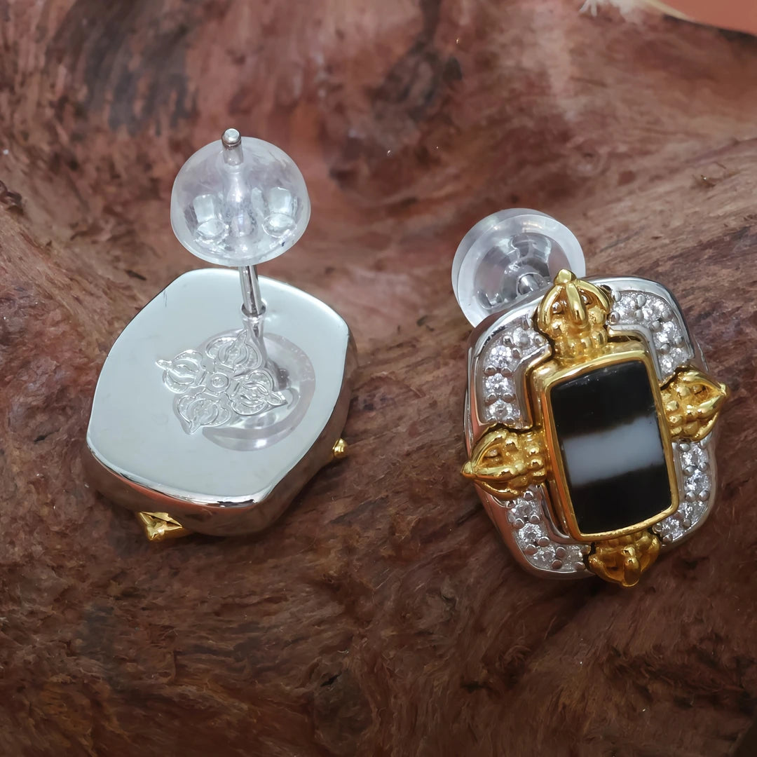 Unique handcrafted silver Vajra Cross and Medicine Buddha earrings, combining traditional Tibetan Buddhist jewelry art with spiritual protection.