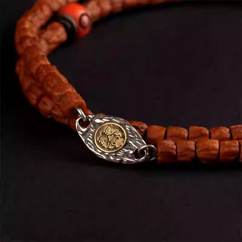 Handmade Tibetan silver snail bead connector, ideal for linking beads on bracelets, vintage style with Vajra and Moon elements, protective and auspicious.