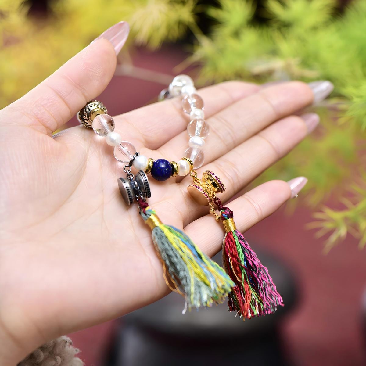 Tibetan Buddhist Jewelry Culture: Traditional sterling silver Damaru hanging charm reflecting ancient Tibetan Buddhist culture and spiritual protection.
