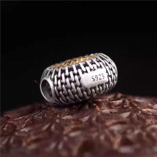 Handmade silver inlaid copper hollow lotus back cloud spacer bead, representing purity in Tibetan Buddhist Jewelry Culture and jewelry art.
