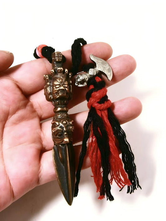 Tibetan Pubha Vajra knot accessory, handwoven and handpainted, symbolizing spiritual power, protection, and prosperity in Tibetan Buddhism.
