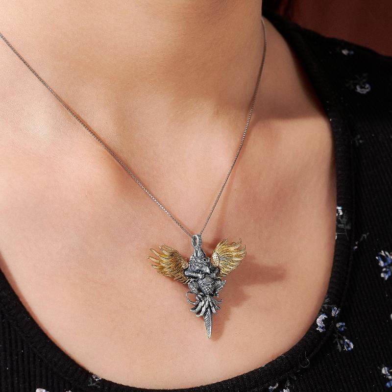 Handcrafted 3D Garuda pendant with silver and copper inlay, Tibetan Buddhist Jewelry Art combining protection, courage, and ethnic craftsmanship.