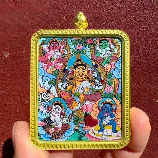 Handcrafted Five Wealth Gods Thangka pendant, Tibetan Buddhist jewelry art combining intricate craftsmanship with auspicious blessings for wealth and spiritual protection.