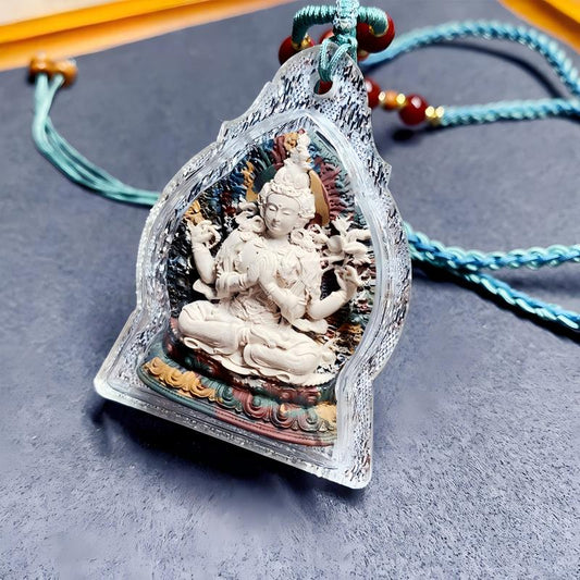 Handcrafted Tibetan Four-Armed Avalokiteshvara mini Thangka pendant in Gau box, blending spiritual symbolism with exquisite Tibetan jewelry art.