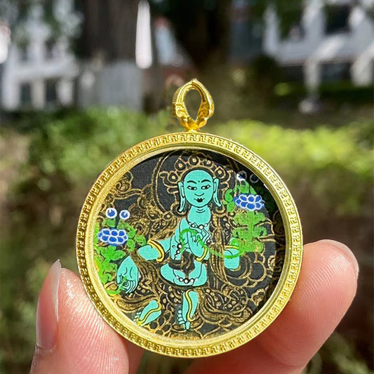 Handcrafted Tibetan pendant featuring Green Tara Thangka in a Gau box, blending spiritual symbolism with exquisite jewelry art.