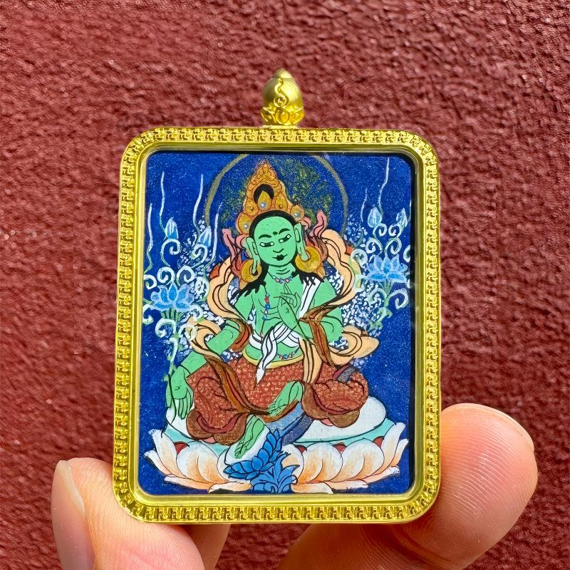 Handcrafted Tibetan pendant showing Manjushri, Amitabha, and Samantabhadra with twelve zodiac guardian Buddhas, blending spiritual symbolism with fine jewelry art.
