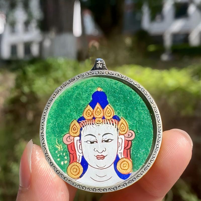 Handcrafted Tibetan pendant showing Manjushri and Samantabhadra with twelve zodiac guardian Buddhas, blending spiritual symbolism with fine jewelry art.