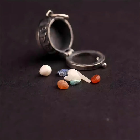 Mini transparent Ghau amulet container integrated into a silver bracelet, exquisite handmade jewelry art.