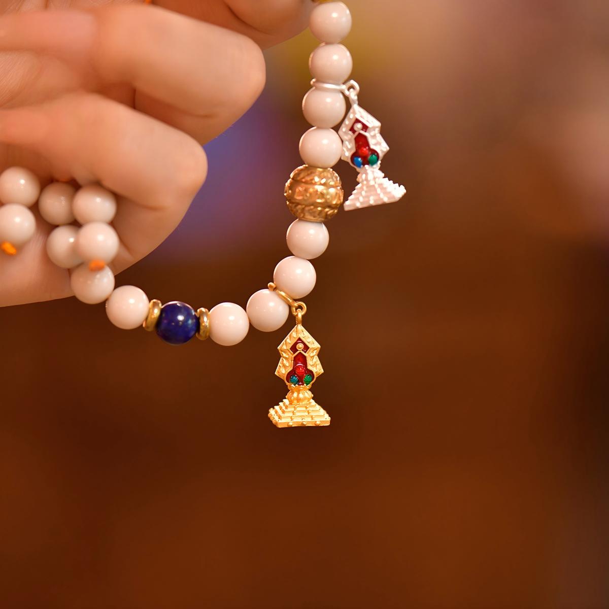 Tibetan Buddhist Jewelry Culture: Traditional Torma offering item, reflecting ancient Tibetan Buddhist sacrificial implements culture and protection.