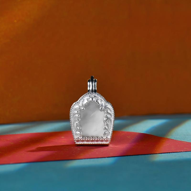 Tibetan Buddhist Jewelry Culture: Sacred silver protection gau box featuring architectural symbols, a unique fusion of protective amulet and Buddhist art.