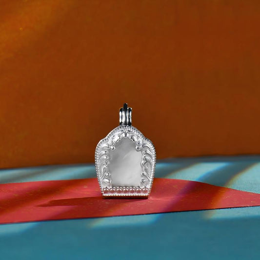 Tibetan Buddhist Jewelry Culture: Sacred silver protection gau box featuring architectural symbols, a unique fusion of protective amulet and Buddhist art.