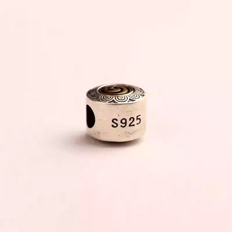 Multi-functional silver and copper mala spacer with a large bore, exquisite jewelry art from Tibetan Buddhist Jewelry Culture.