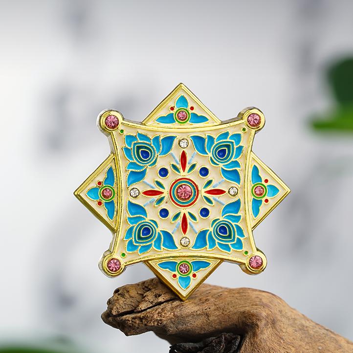 Handcrafted gilded metal badges inspired by Tibetan Buddhist Jewelry Culture, symbolizing good fortune and protection.