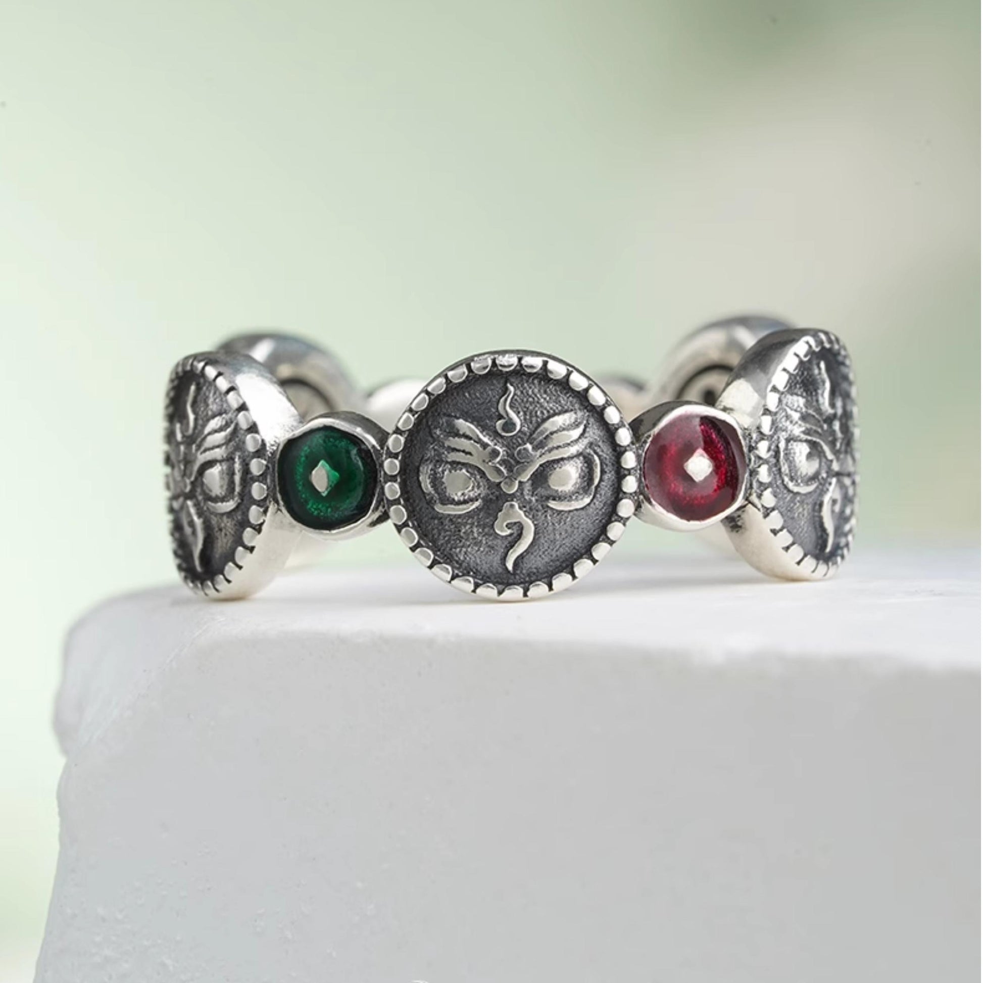 Handcrafted sterling silver harmony ring symbolizing the five directions in Tibetan Buddhist Jewelry Culture, featuring unique hand-painted Jewelry art.