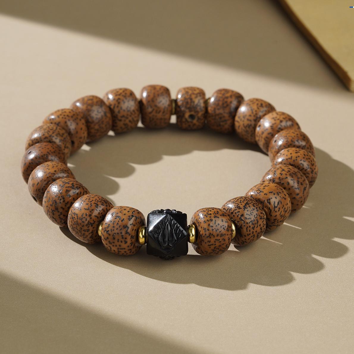 Bodhi Obsidian Moon Star design bracelet showcasing Tibetan Buddhist jewelry art, balancing enlightenment and grounding energies.