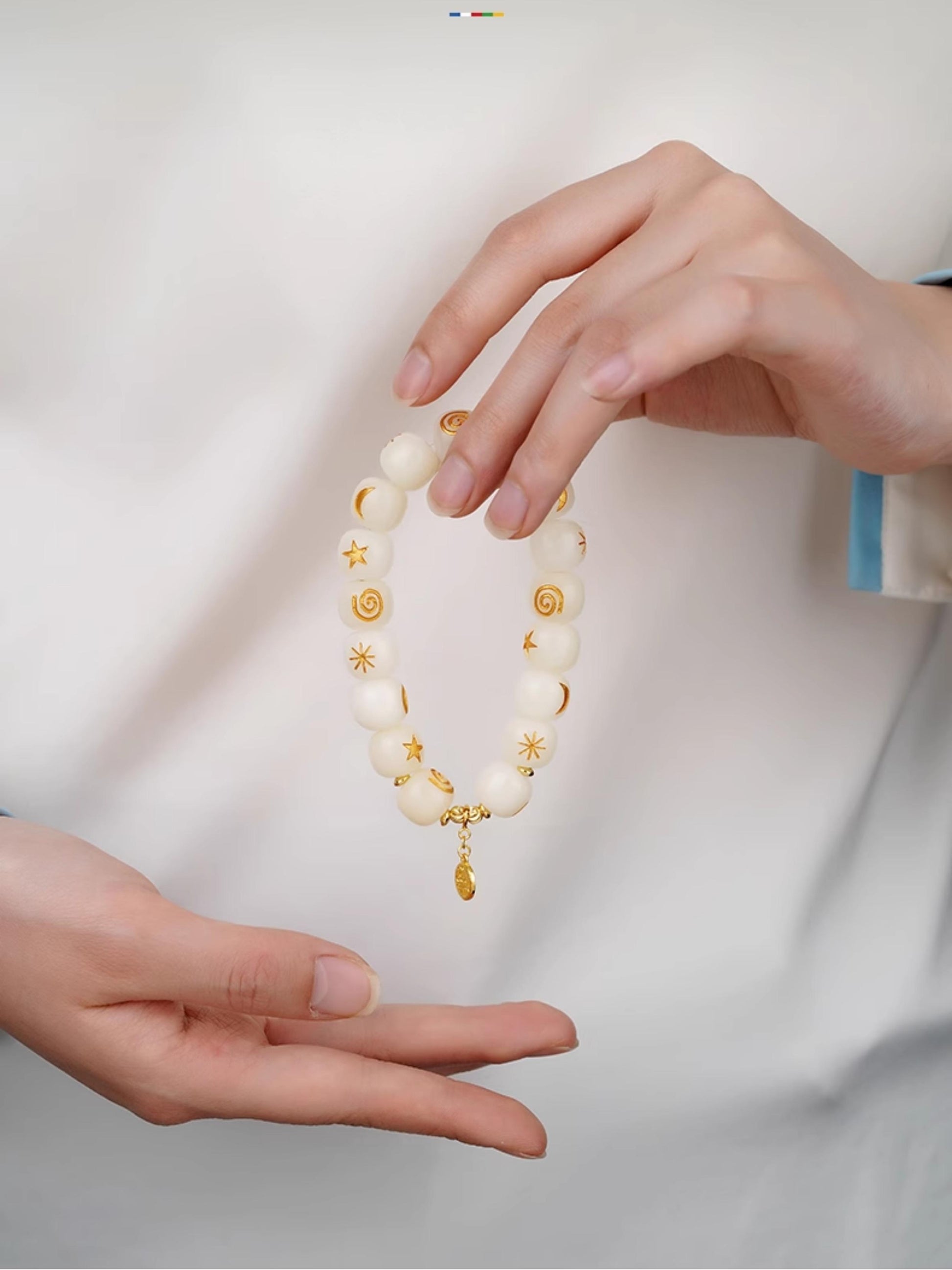 White Bodhi Seed Mala Bracelet, a masterpiece of Tibetan-Buddhist-Jewelry-Culture and traditional Jewelry-art. This eco-friendly, hand-strung bracelet is perfect for daily spiritual intention and style.