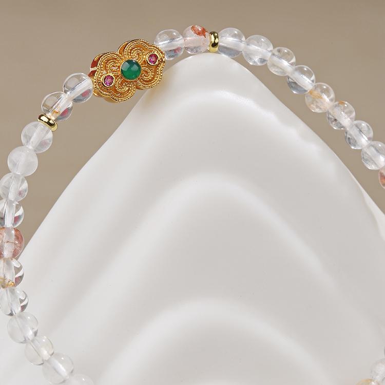 Crystal and copper energy bracelet featuring traditional Tibetan Buddhist jewelry art, designed for meditation and spiritual practice.