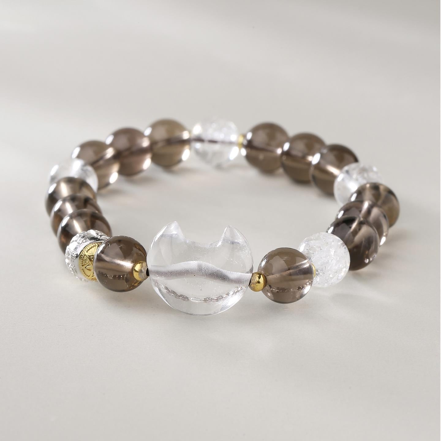 Quartz Crystal balance bracelet showcasing Tibetan Buddhist jewelry art, combining grounding and purifying properties.
