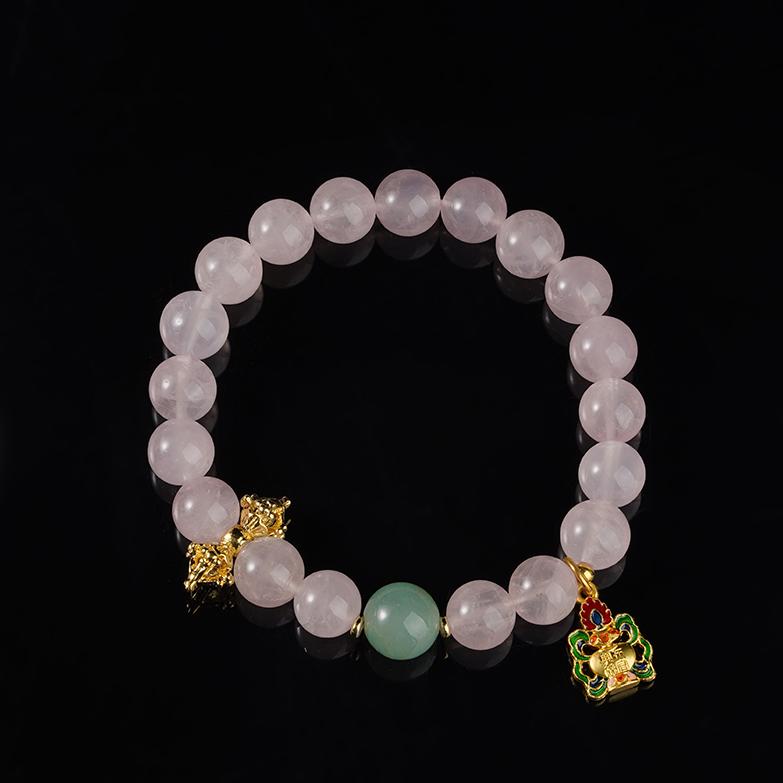 Blossom Glow rose quartz bracelet in Tibetan Buddhist jewelry art, featuring hand-painted designs for love energy and compassionate heart