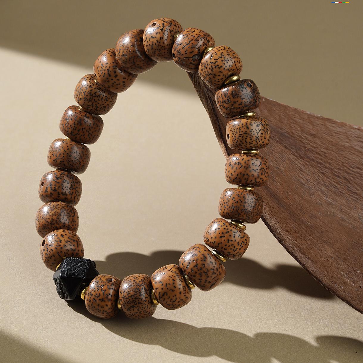 Star Moon Bodhi and Obsidian bracelet in Tibetan Buddhist jewelry art, combining enlightenment energy with protective properties in hand-painted design.