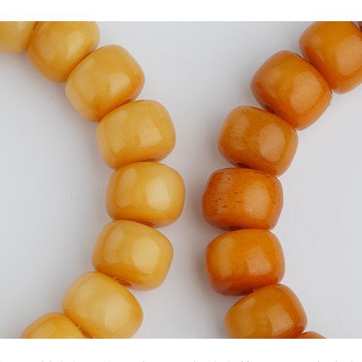 Ox bone and incense ash ritual bracelet showcasing Tibetan Buddhist jewelry art, featuring traditional hand-painted spiritual motifs.