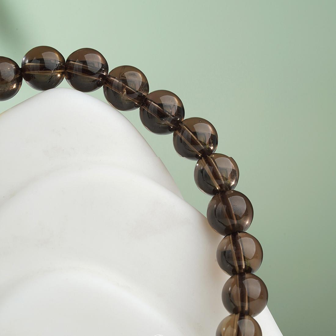 Artisanal handmade Tiger's Eye bracelet featuring unique spiritual jewelry art, crafted with traditional Tibetan Buddhist techniques.