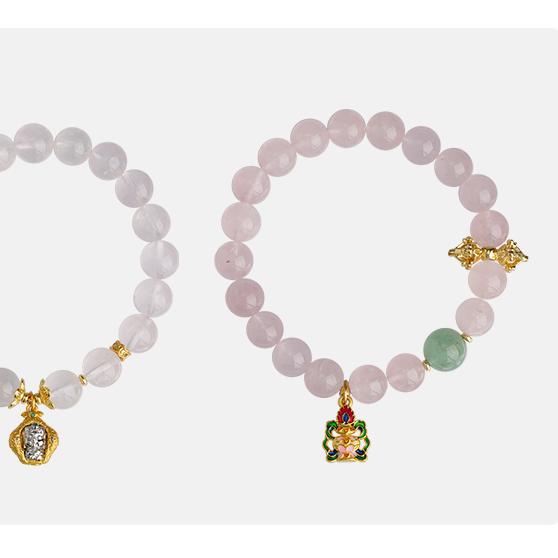 Hand-painted mandala rose quartz bracelet symbolizing divine love in Tibetan Buddhist jewelry tradition