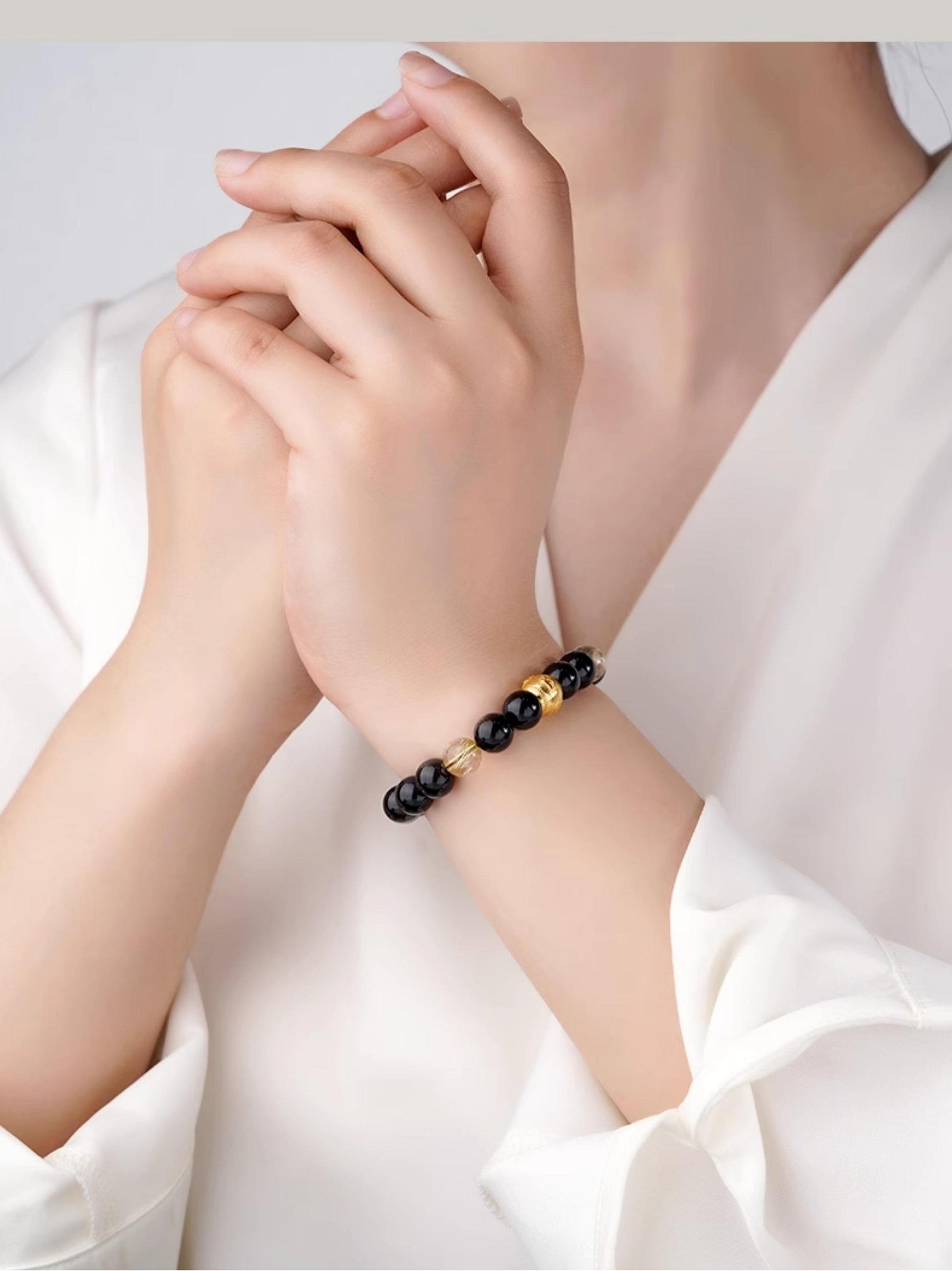 Deep Star Obsidian bracelet promoting inner peace through authentic Tibetan Buddhist jewelry art.
