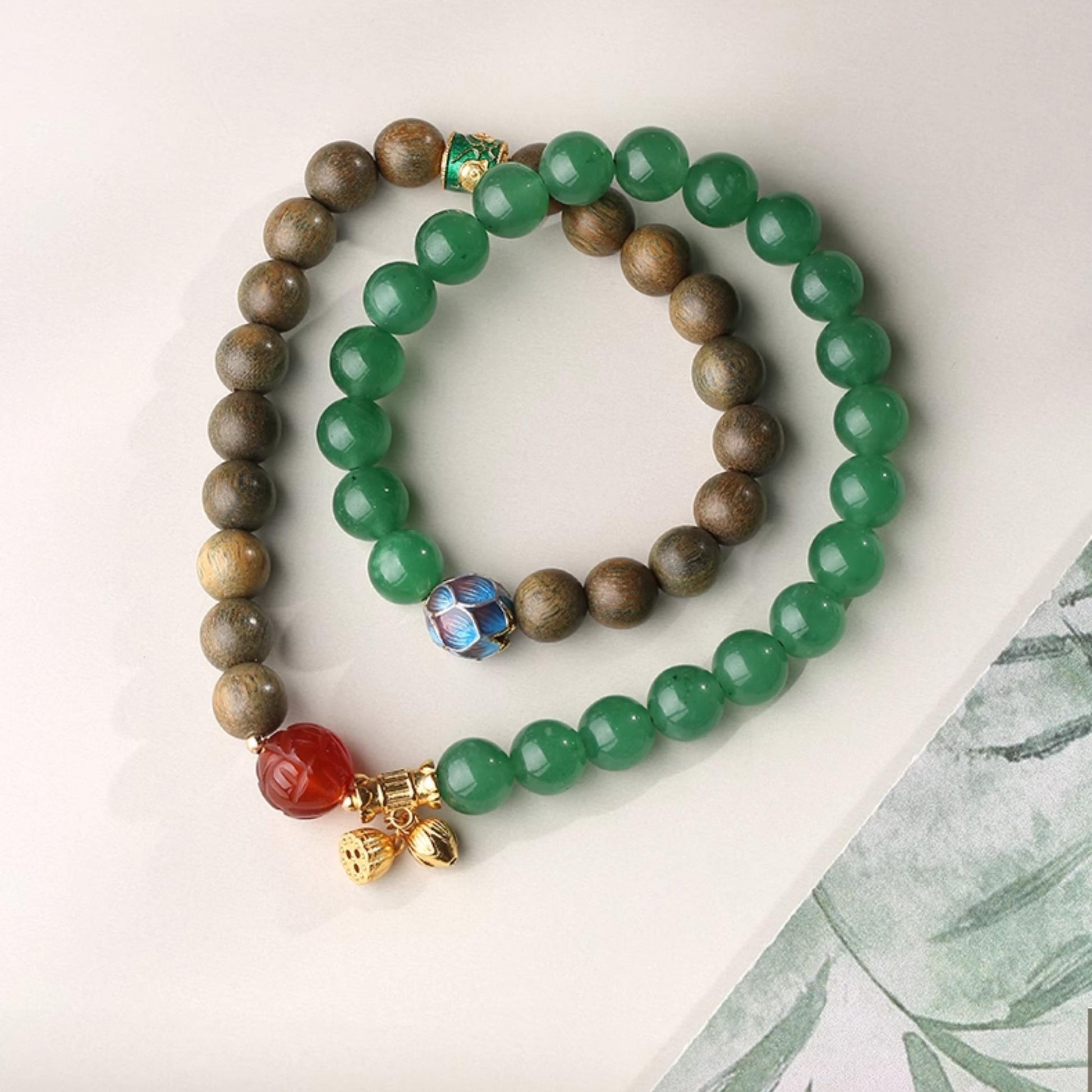 Hand-painted green sandalwood and agate natural energy bracelet in Tibetan Buddhist jewelry culture, promoting connection with nature's balance.