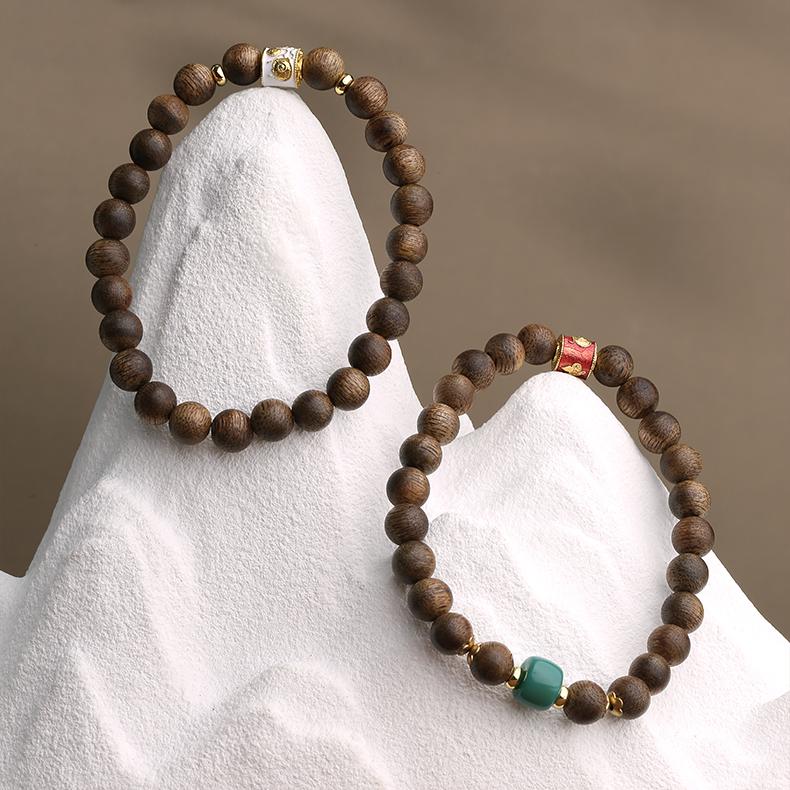 Sacred Agarwood Mountain Snow design in Tibetan Buddhist jewelry art, combining natural elements for spiritual practice.