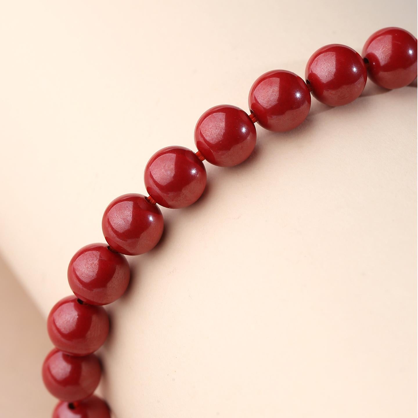 Cinnabar Amber abundance bracelet showcasing Tibetan Buddhist jewelry art, representing flourishing energy and material blessings.