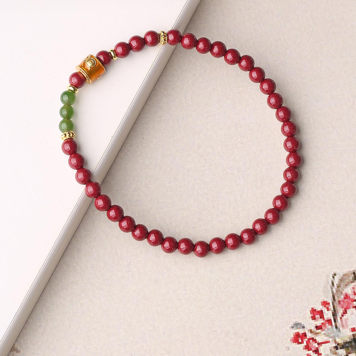 Cinnabar Jade Time Blessing bracelet showcasing Tibetan Buddhist jewelry art, representing everlasting protection and spiritual grace.