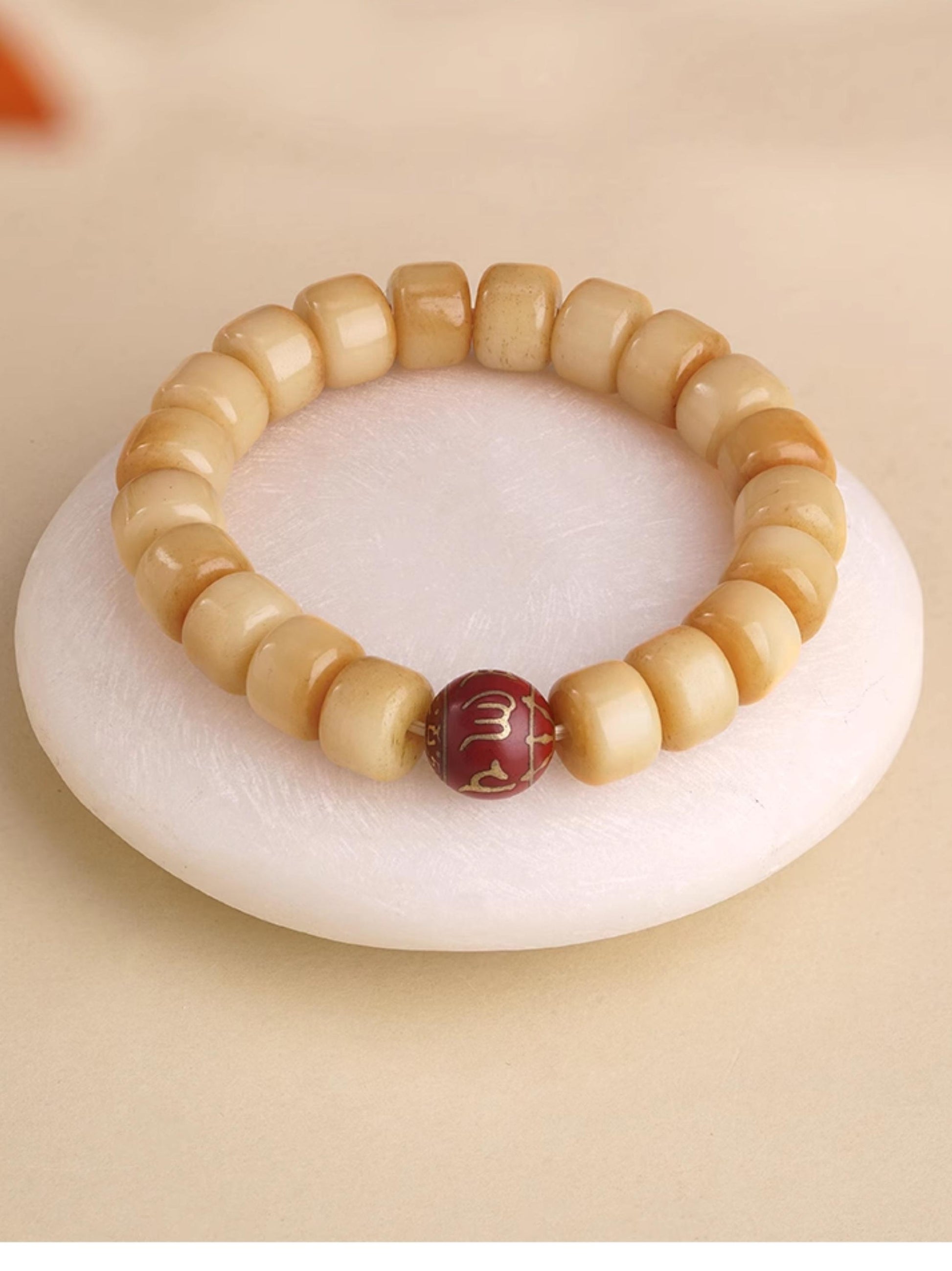 Sacred bone ash mala for spiritual practice in Tibetan Buddhist tradition, hand-painted with mantras and ritual designs.