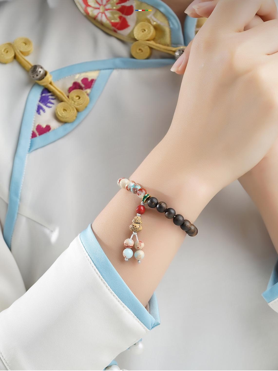 Artisanal Shoushan Stone and Agarwood beads for spiritual protection, representing authentic Tibetan Buddhist jewelry art craftsmanship.