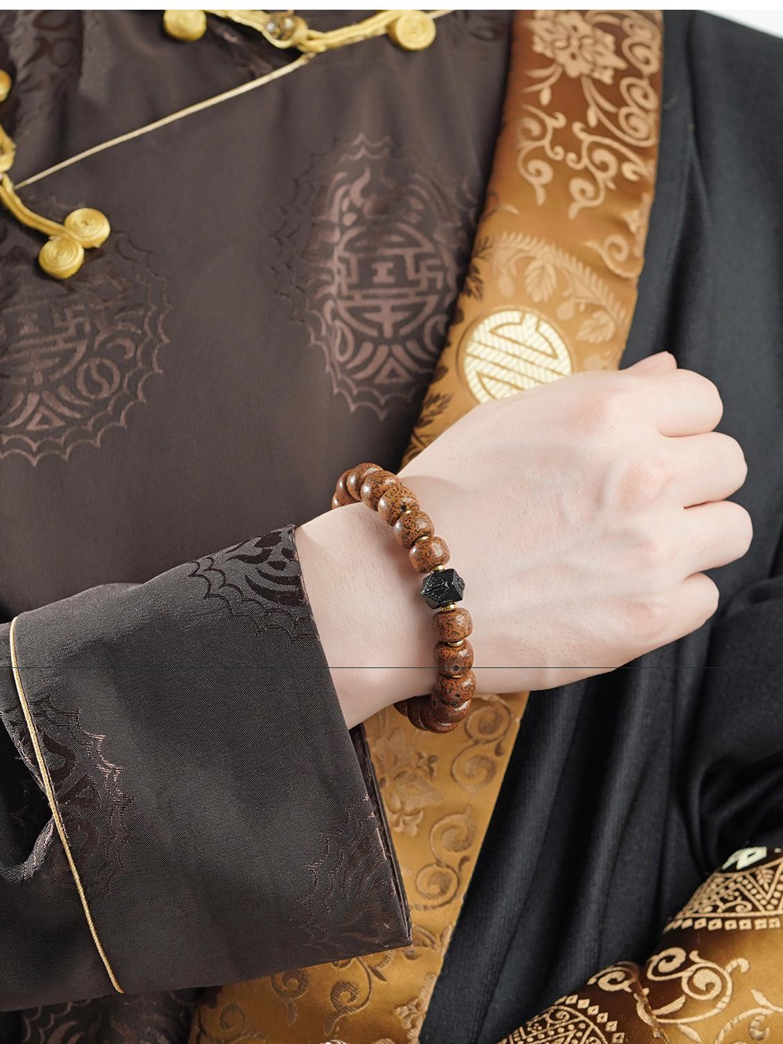 Artisanal Bodhi and Obsidian beads in Tibetan Buddhist jewelry tradition, hand-painted with sacred geometric patterns for meditation.