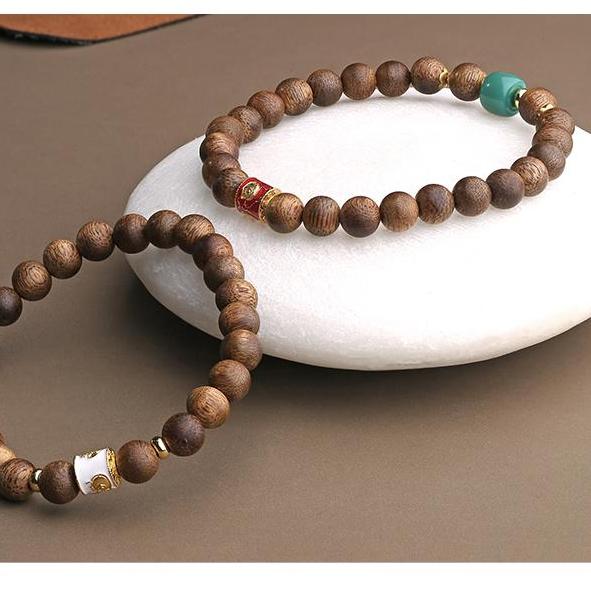 Blossom Falls Shadow Sinks agarwood design showcasing Tibetan Buddhist jewelry culture, representing impermanence and enlightenment.