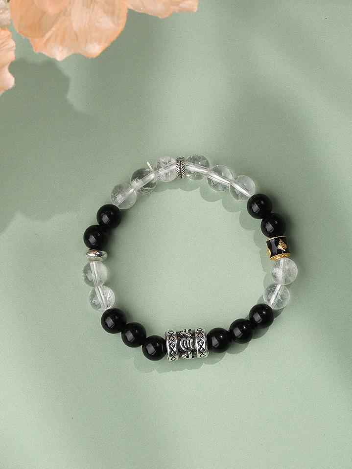Sacred Obsidian Crystal Balance Bracelet being worn. The harmonious black and white gemstone pairing symbolizes yin-yang balance, helping wearer stabilize emotions and enhance mental focus.