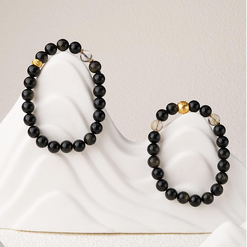 Artisanal Obsidian and crystal mala for spiritual guidance, representing traditional Tibetan Buddhist jewelry art.